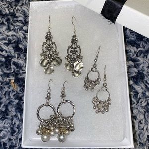 Silver earring set.